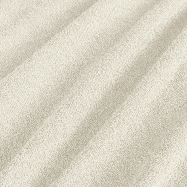 Pościel frotte w kolorze ecru, o wymiarach 160x200 cm, z widoczną fakturą materiału. Ułożona poziomo, z bliska ukazująca pojedyncze wąskie pasy. Tło jednolite, podkreślające materiał i jego miękkość.