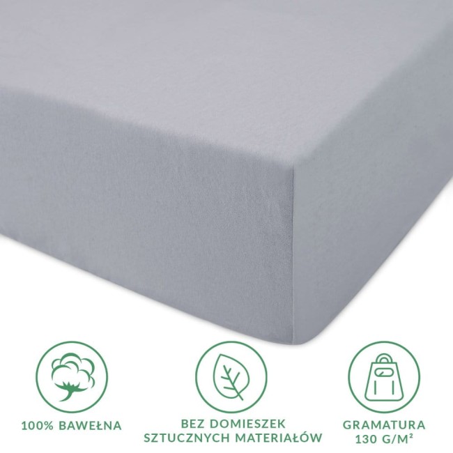 Prześcieradło jersey z gumką w kolorze popielatym, o wymiarach 200x220 cm, leżące na płaskiej powierzchni. Wykonane w 100% z bawełny, z gramaturą 130 g/m², bez domieszek sztucznych materiałów.