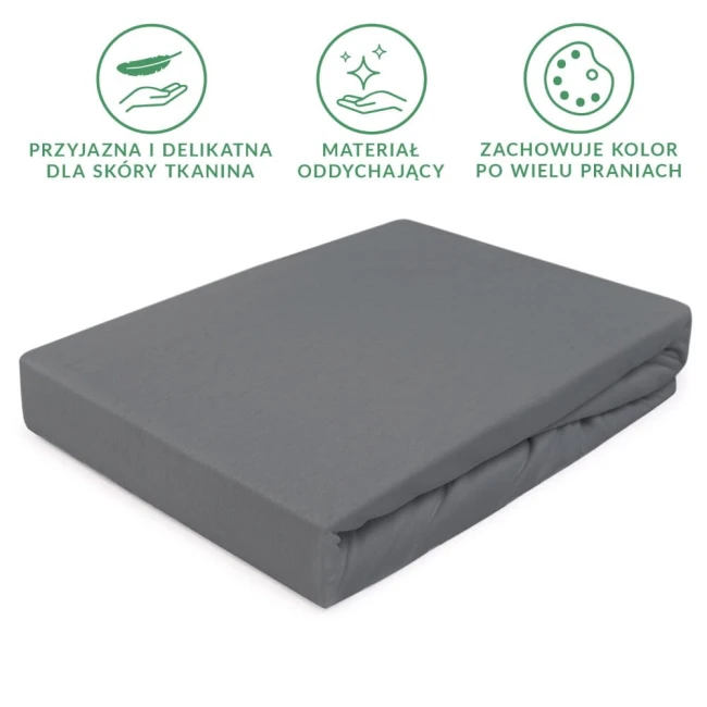 Prześcieradło jersey z gumką 90x200 w kolorze szarym, wykonane z delikatnej, oddychającej tkaniny, leżące na białym tle. Produkt ma prosty, złożony kształt z gumką, co zapewnia dobre dopasowanie do materaca. Widoczne detale: tekstura materiału.