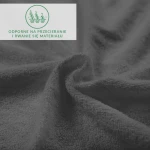 Prześcieradło frotte o wymiarach 120x200 w kolorze antracytowym, z widoczną teksturą materiału. Zdjęcie zbliżone, ukazujące miękką powierzchnię oraz szczegóły splotu, z informacją o trwałości materiału w rogu.