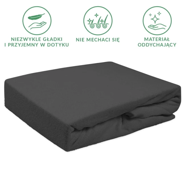 Prześcieradło frotte z gumką w kolorze antracytowym, leżące na białym tle, z widoczną miękką fakturą materiału. Produkt złożony, idealnie dopasowany do materaca w rozmiarze 120x200 cm. Wysoka elastyczność i odporność na mechacenie.