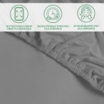 Ochronne prześcieradło z gumką 90x200 SMARTCEL w kolorze szarym, rozłożone na jednolitym tle. Widoczne detale gumki obszytej wokół krawędzi, zapewniającej elastyczne dopasowanie. Tkanina matowa, z lekką teksturą. Brak dodatkowych napisów lub logo.