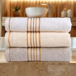 Komplet ręczników z bawełny w eco pudełku jasny szary i ciemny turkus z bordiurą w złote paski 500 g/m2 TIWANO 4 kpl.