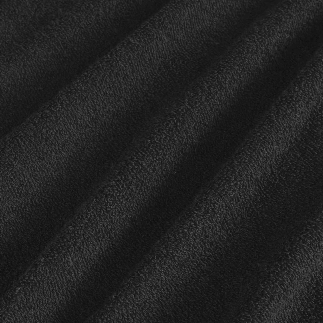 Pościel frotte w kolorze czarnym, w rozmiarze 155x220 cm, o teksturowanej powierzchni. Widoczne fałdy materiału podkreślają jego miękkość i grubość, idealna do użycia w sypialni.